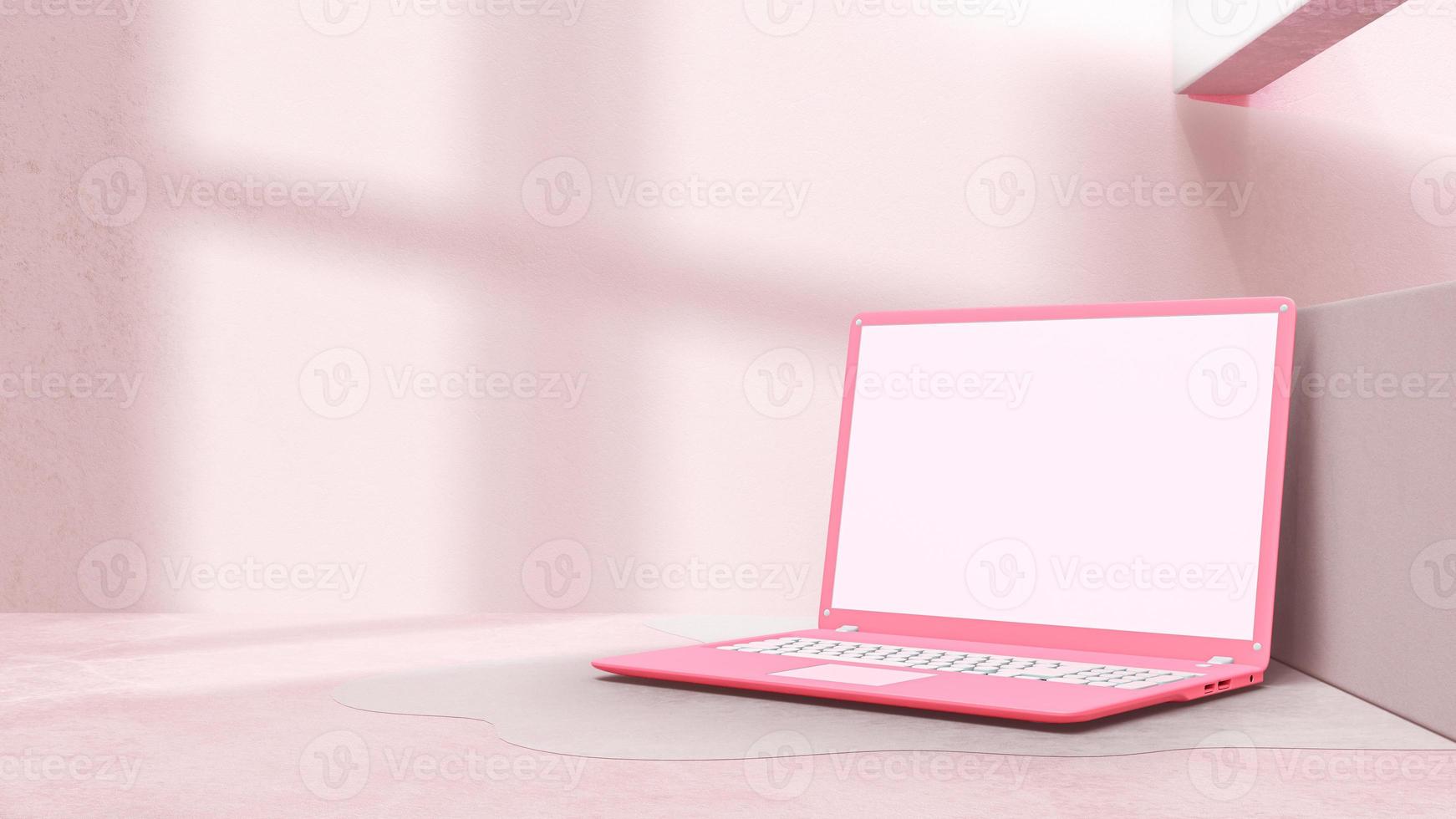 rosa laptop med minimal dekoration. skugga från fönster på cementgolv. modelldator. foto