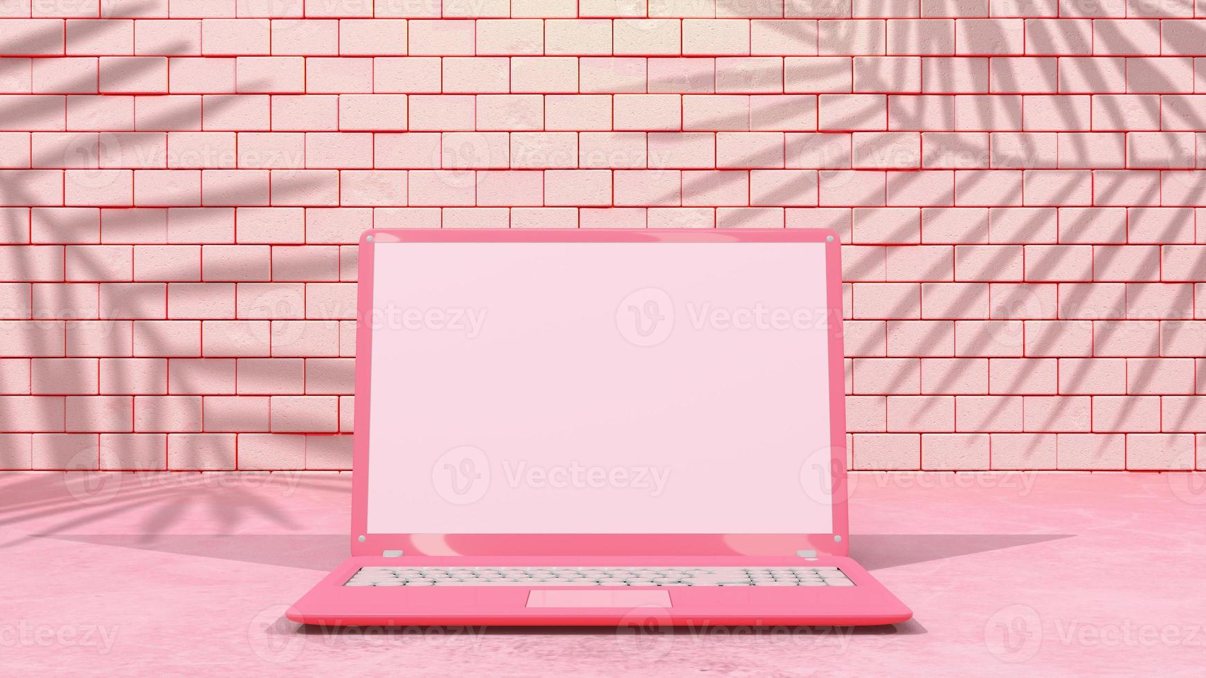 rosa laptop med minimal dekoration. skugga från träd och fönster på tegelvägg. mock-up dator. foto