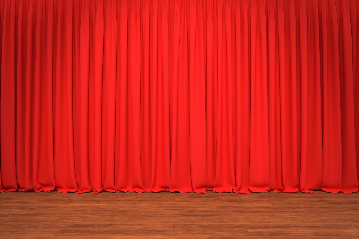 teaterscen med röda gardiner i bakgrunden foto