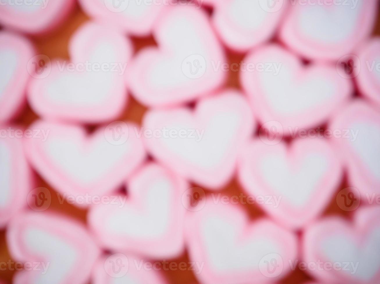 oskärpa rosa hjärta form marshmallow för alla hjärtans bakgrund foto