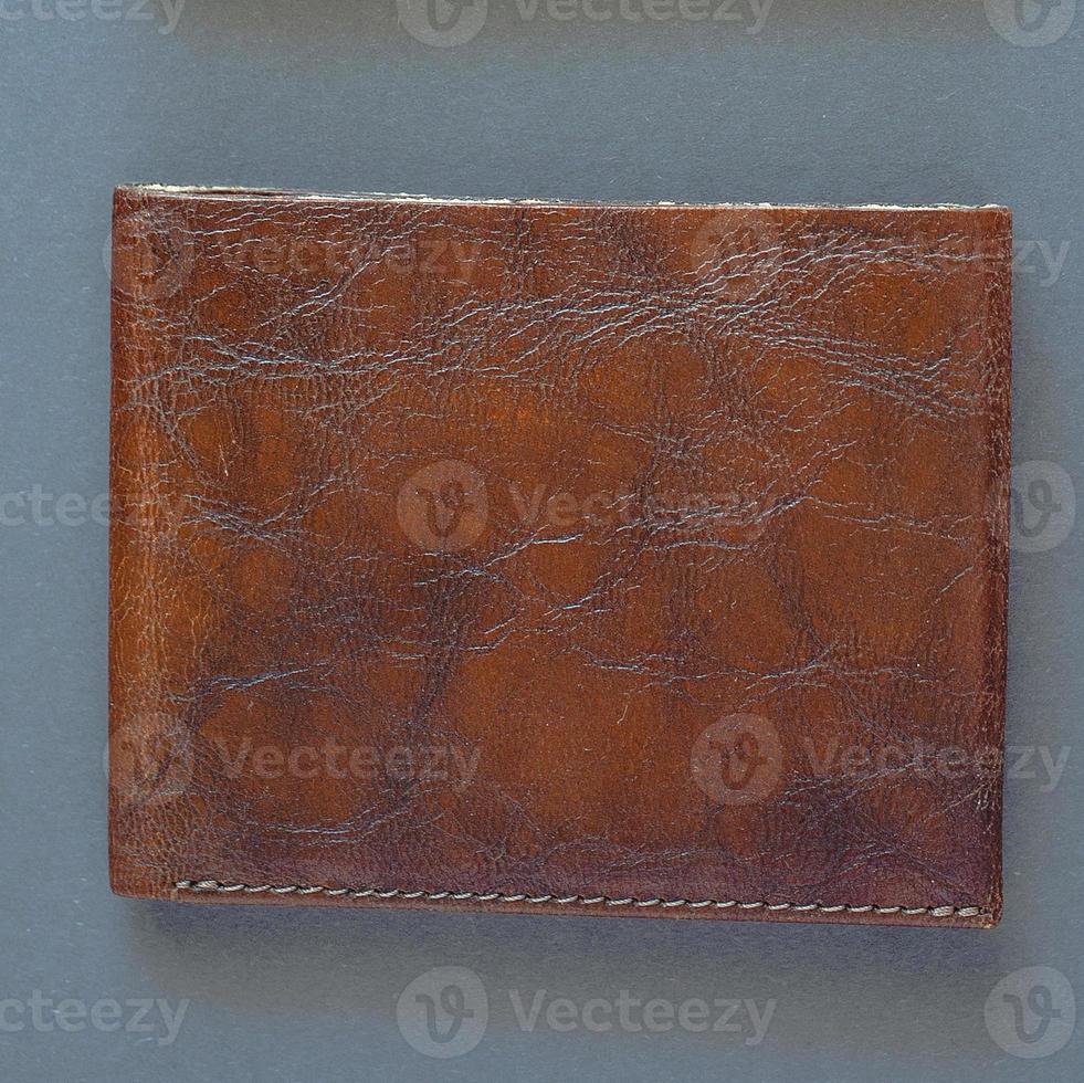 tre brunt läder handgjorda hantverk vintage plånböcker på grå bakgrund foto
