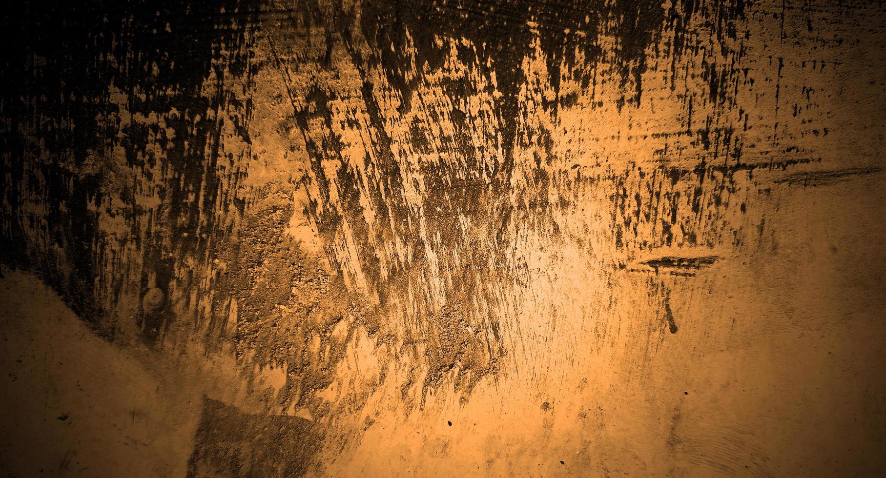mörkgul betong skrämmande för bakgrunden. gul vägg halloween bakgrund koncept. skräck cement textur foto
