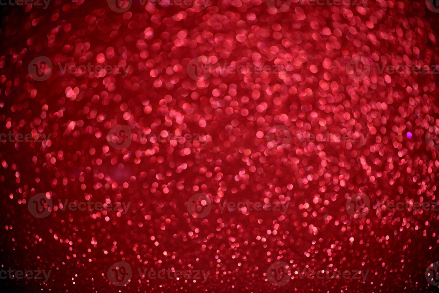 rött glitter bokeh ljus suddig abstrakt bakgrund för alla hjärtans dag, födelsedag, årsdag, bröllop, nyår och jul foto
