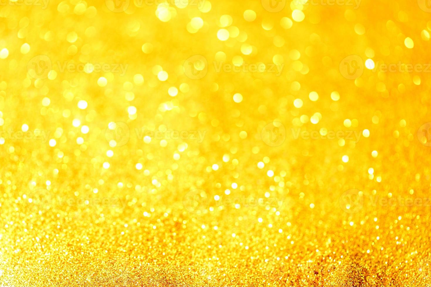 gyllene glitter bokeh belysning textur suddig abstrakt bakgrund för födelsedag, årsdag, bröllop, nyårsafton eller jul foto