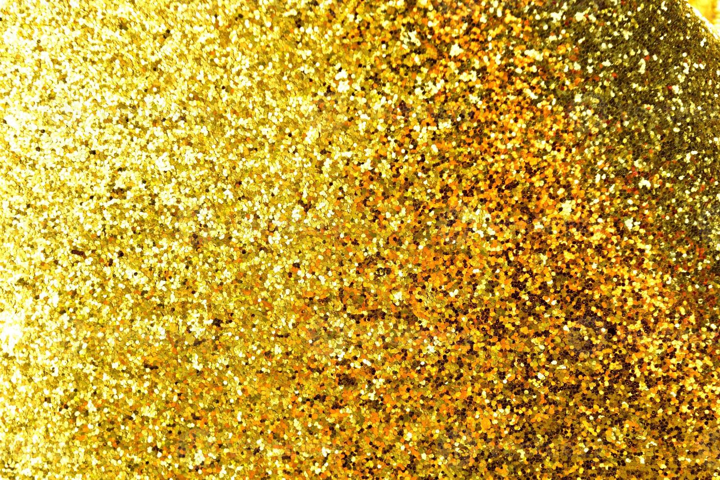 gyllene glitter bokeh belysning textur suddig abstrakt bakgrund för födelsedag, årsdag, bröllop, nyårsafton eller jul foto