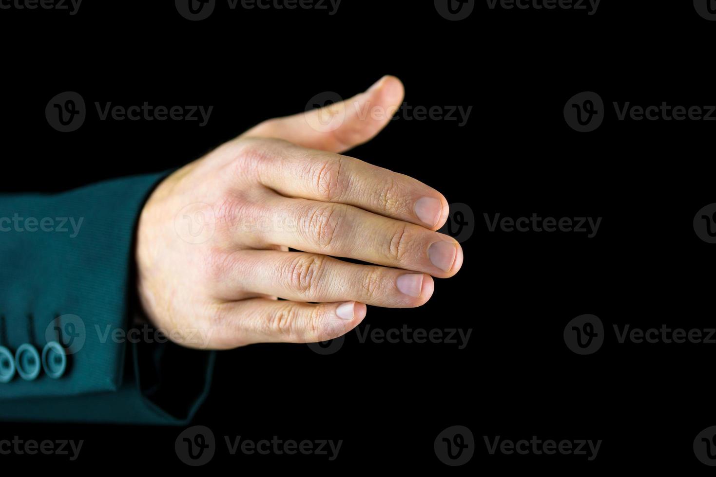 människans högra hand, redo för ett handskak foto