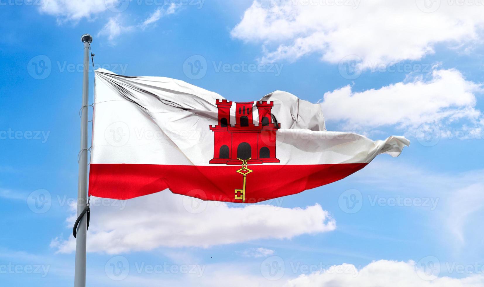 gibraltarflagga - realistiskt viftande tygflagga. foto