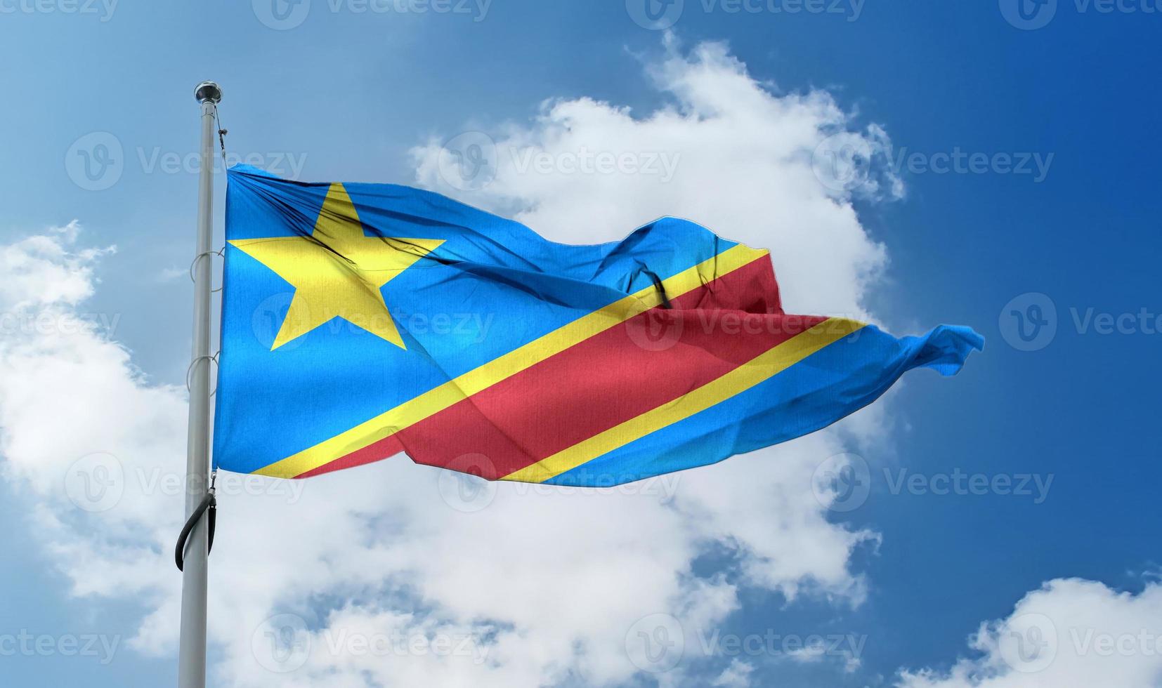 demokratiska republiken Kongoflaggan - realistiskt viftande tygflagga. foto