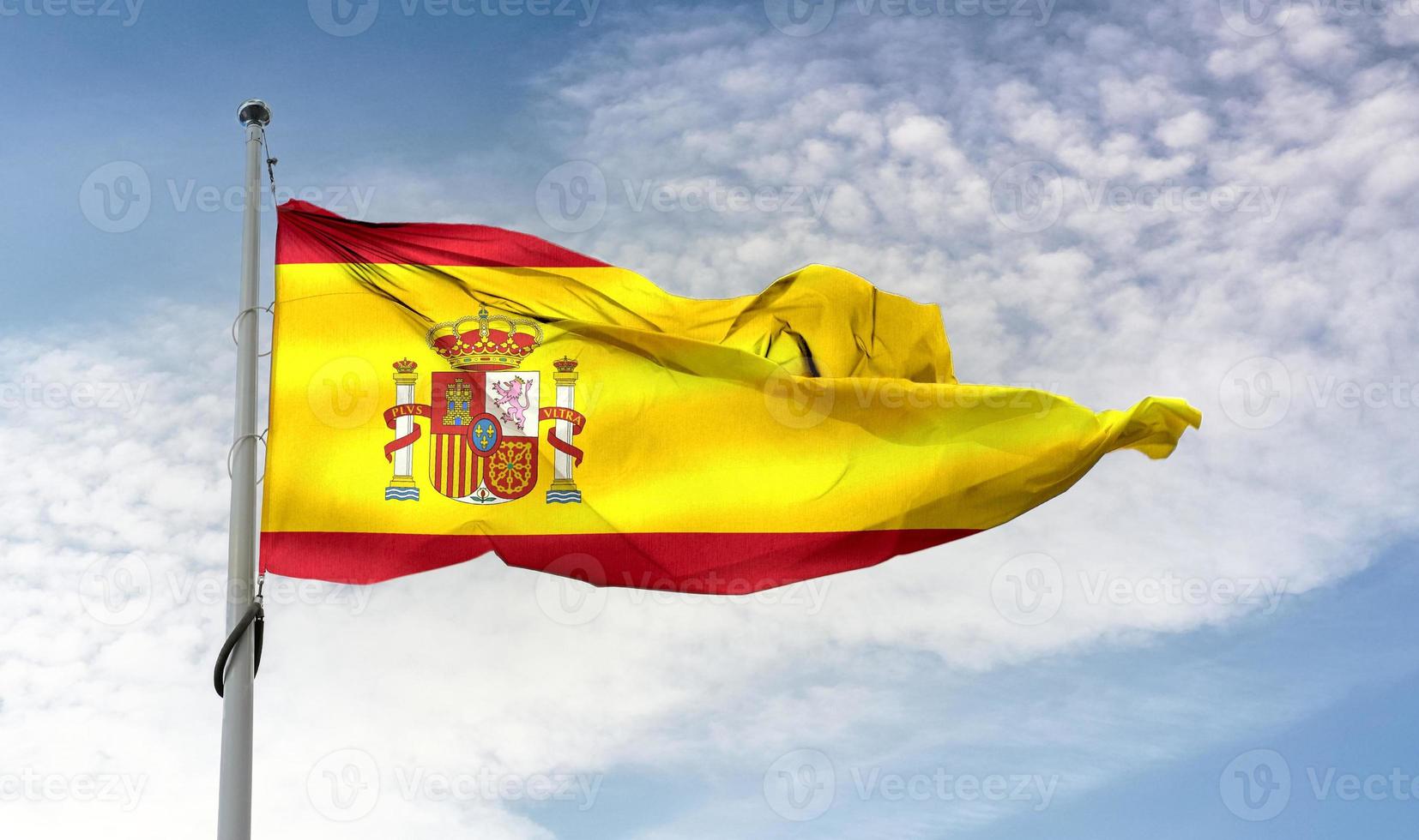 spaniens flagga - realistiskt viftande tygflagga foto