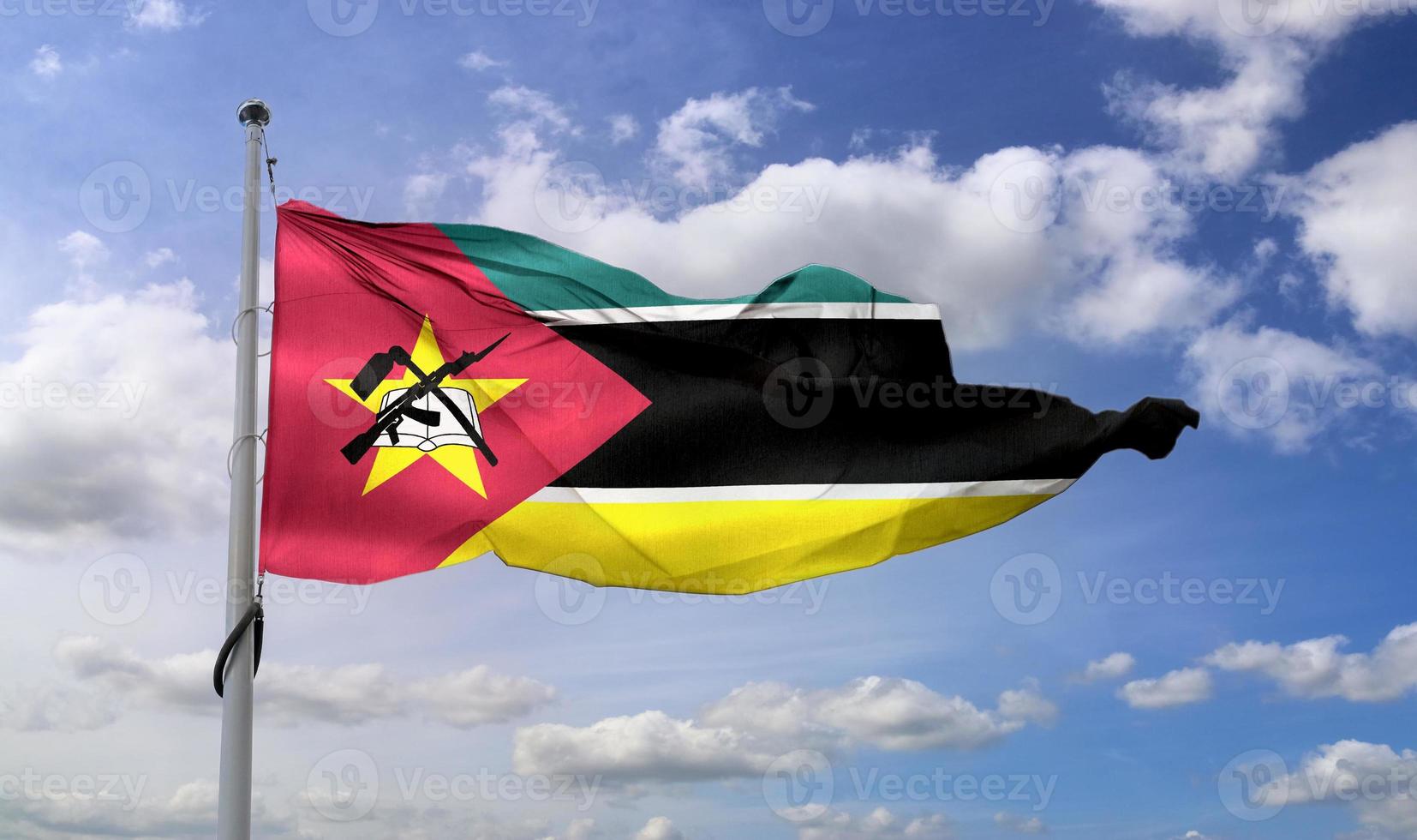 moçambique flagga - realistiskt viftande tygflagga. foto