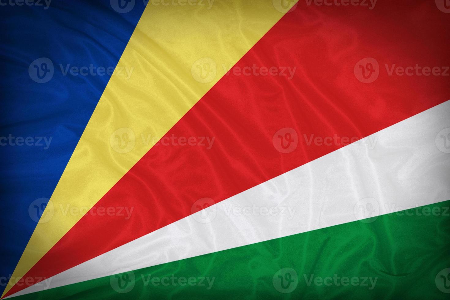 Seychellerna flagga mönster på tyg konsistens, vintage stil foto