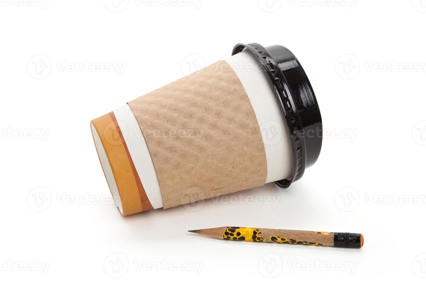 engångs kaffekopp och penna foto