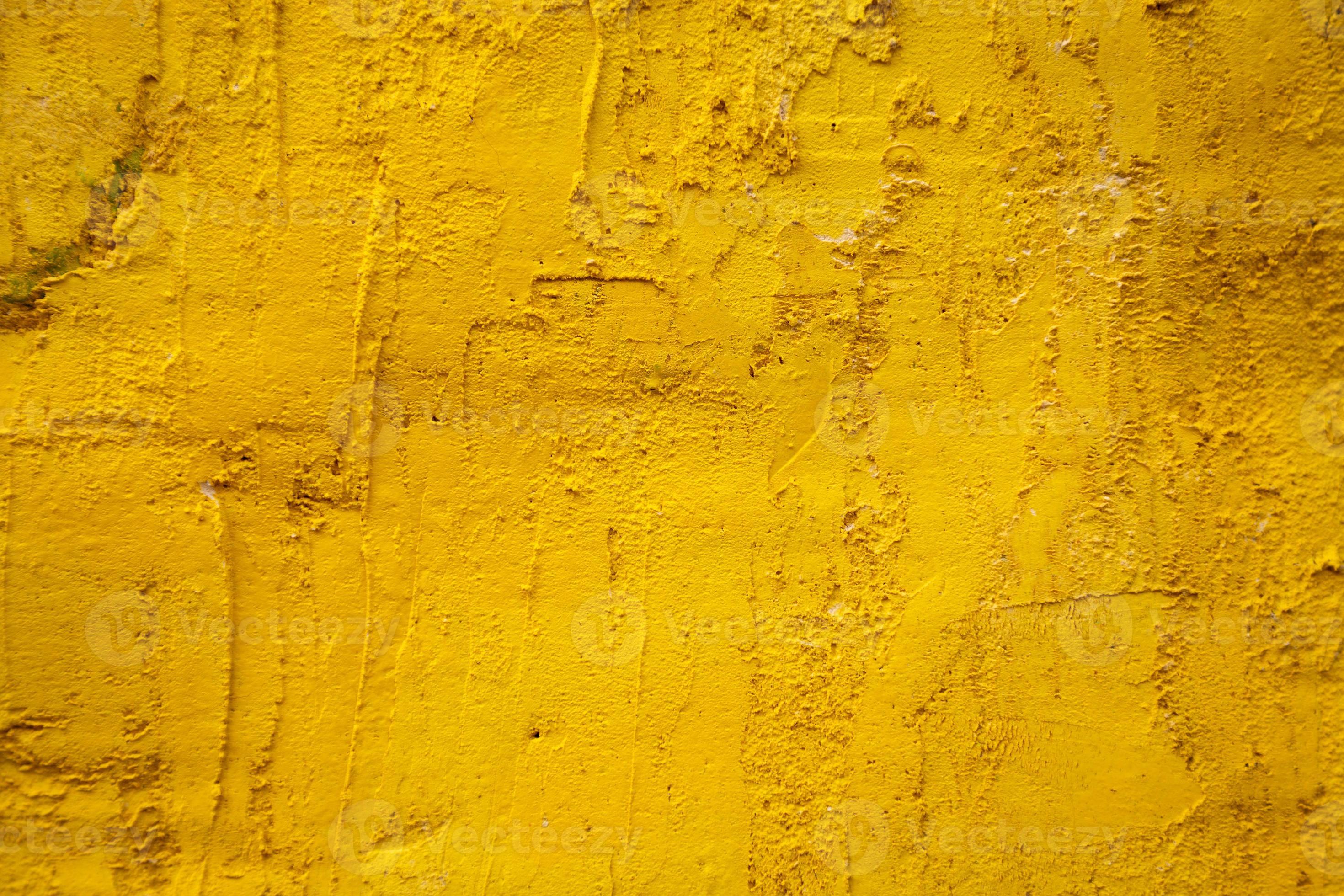 gammal gul cementvägg foto