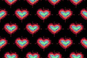 mönster av frihandsskiss form hjärta, färgglada röd grön blå gul orange färg designelement isolerade på svart bakgrund, symbol kärlek alla hjärtans dag, textiltyg foto