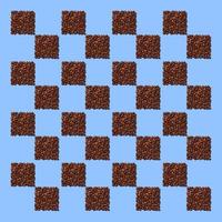 rutor från kaffekorn på blå bakgrund. ett mönster i form av ett schackbräde av kaffebönor hällt i form av rutor. foto