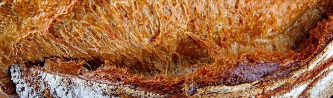 hemlagad bröd yta. skön skorpa av bröd närbild. foto