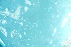 blå flytande gel textur bakgrund. abstrakt flytande med bubblor. kosmetisk swatch foto