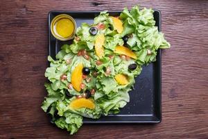 citrus- sallad med granatäpple frön foto