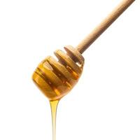 honungskopa med gyllene honung foto