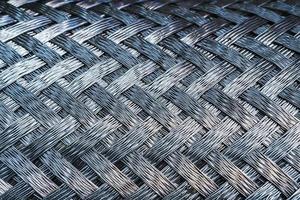 metall textur med en fiskbens mönster av stål. foto
