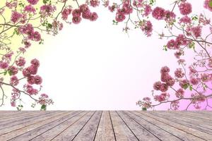 topp skrivbord med rosa trumpet blomma, trä tabell foto