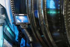 industriell video endoskop för övervakning de inre stat av gas turbin växter. foto