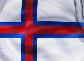 Färöarnas flagga - realistiskt viftande tygflagga foto