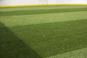 gräsmatta på fotboll fält. artificiell beläggning på sporter jord. foto