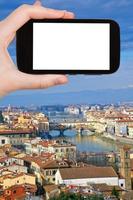 smartphone och florens stadsbild foto