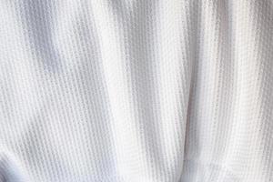 vit fotbollströja kläder tyg textur sport slitage bakgrund foto