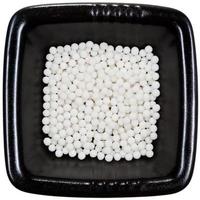 socker homeopati bollar på svart tallrik stänga upp foto