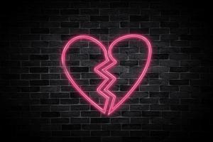 hjärta bruten tecken symbol neon baner på tegel vägg bakgrund. foto