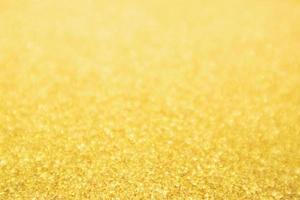 abstrakt guld glitter festlig jul textur bakgrund oskärpa med bokeh ljus foto