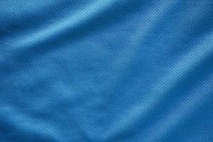 blått tyg sportkläder fotbollströja med air mesh textur bakgrund foto