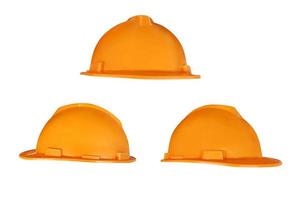 orange hjälm uppsättning industriell säkerhet konstruktion verktyg isolerat på en vit bakgrund foto