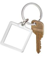 hus mässing nyckel och fyrkant Nyckelring på ringa foto