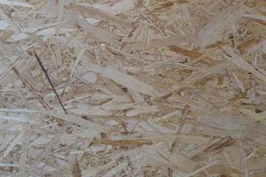 nedtryckt sågspån plywood, trä textur foto
