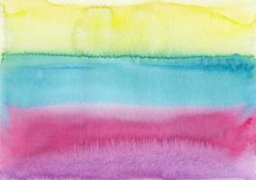 vattenfärg färgrik randig bakgrund textur. gul, blå, rosa fläckar på papper, hand målad. foto