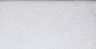 vit polystyren skum styrelse, hög kvalitet Frigolit textur bakgrund, stänga upp av en porös vit yta foto