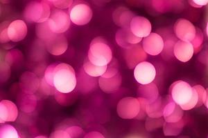 rosa skinande glitter Semester skön abstrakt fläck bokeh bakgrund foto