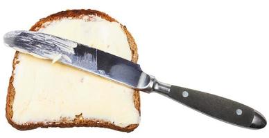 spannmål bröd och Smör smörgås med tabell kniv foto