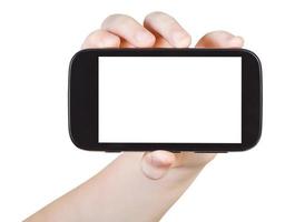 barn innehar smart telefon med skära ut skärm foto