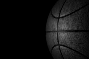 basketboll på en svart bakgrund. 3d framställa foto