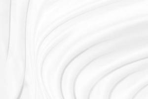 skönhet slät elegans mjuk tyg vit abstrakt kurva form dekorativ mode textil- bakgrund foto