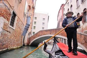 Venedig Italien, gondol förare i stor kanal foto