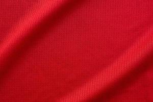 sporter Kläder tyg fotboll jersey textur topp se röd Färg foto