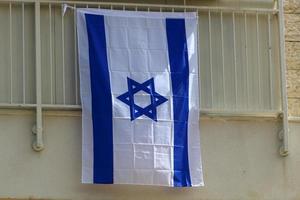 de blå och vit flagga av Israel med de sexuddig stjärna av david. foto