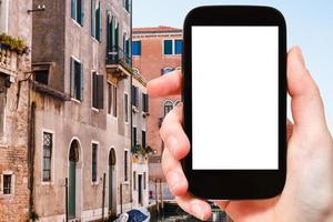 turist fotografier hus i Venedig stad foto