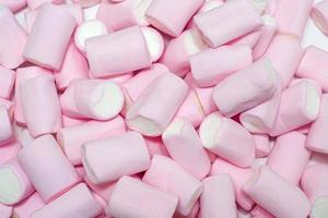 topp skott texturerad bakgrund med vit och rosa marshmallow foto