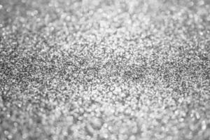 abstrakt fläck silver- glitter gnistra defocused bokeh ljus bakgrund foto